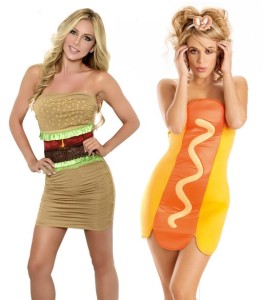 Two women in tight fitting mini dresses, one patterned like a hamburger, the other like a hot dog