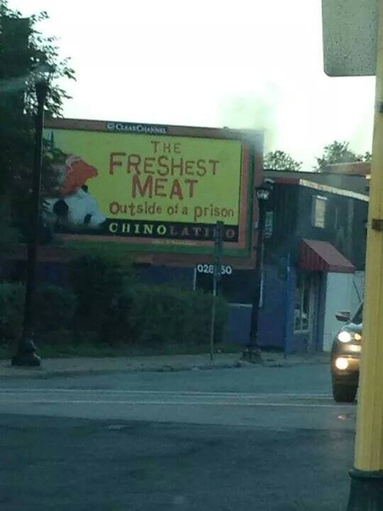 Billboard that reads "The Freshes Meat outside the prison"