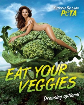 PETA ad showing a nude woman laying on a giant bunch of broccoli; reads, "EAT YOUR VEGGIES"