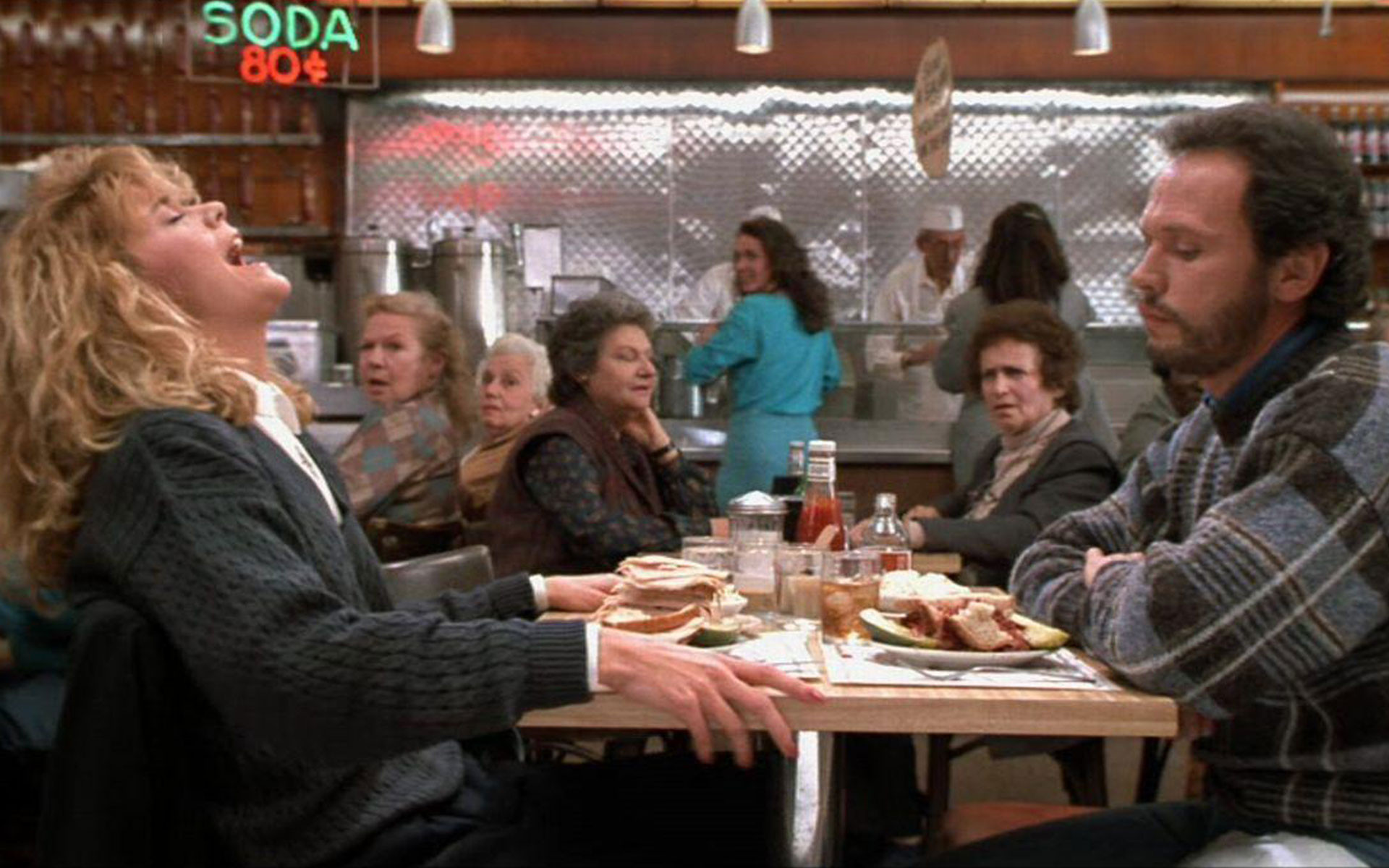 Famous diner scene from "When Harry Met Sally" where Sally fakes an orgasm over a nonvegan sandwich